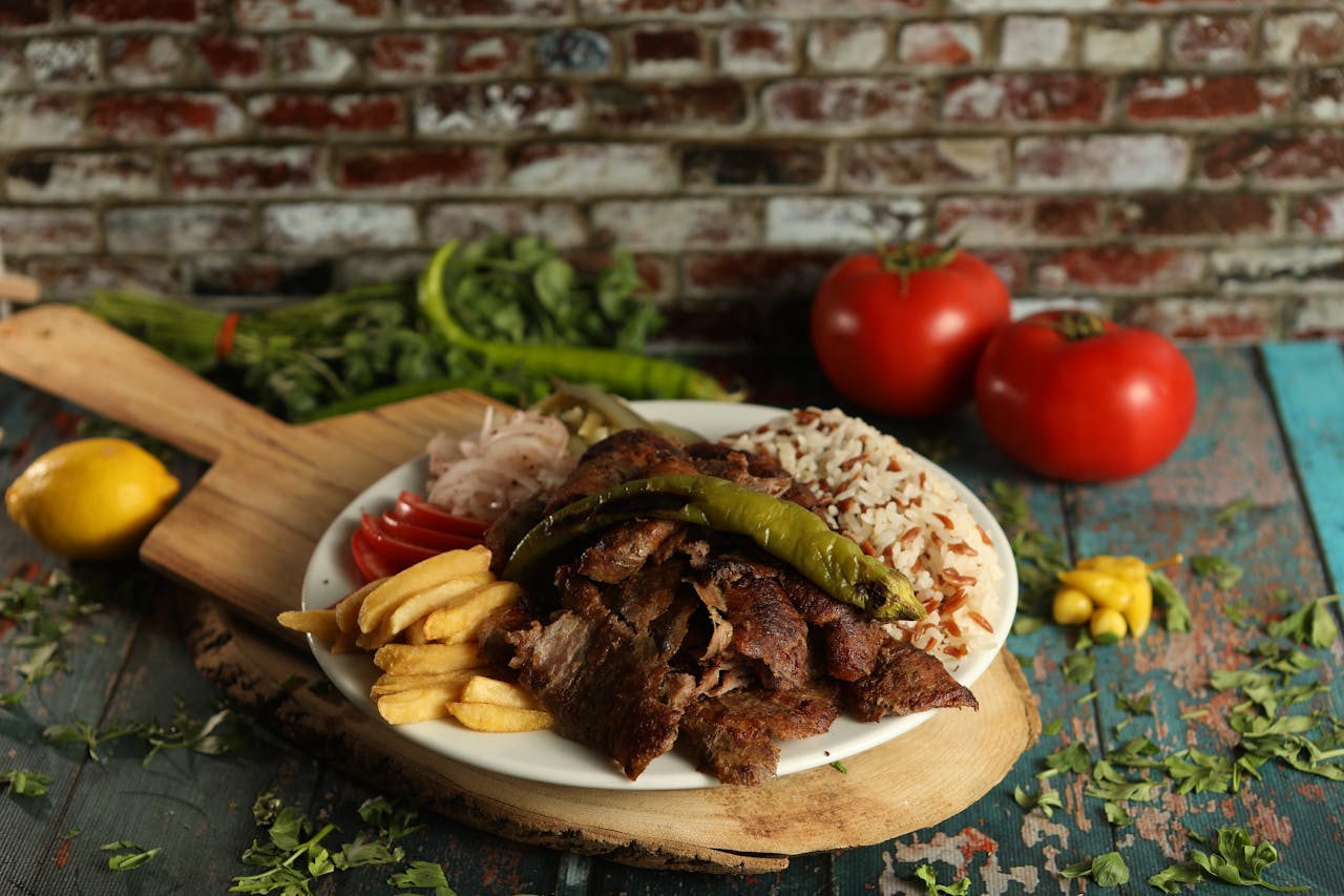 Delicious traditional Turkish doner kebab served with fries, rice, and vegetables. Perfect for food enthusiasts.
